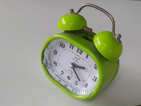 An image of an alarm clock on a white background Stock Photos