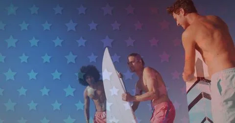 Image of american flag pattern over friends with surfboards on beach Stock Photos