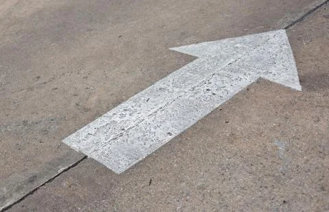 An image of an arrow on the road Stock Photos