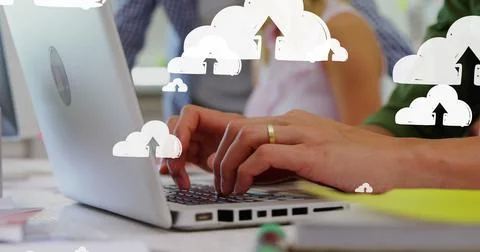 Image of up arrows in clouds over midsection of caucasian man typing on keyboard Stock Photos