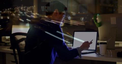 Image of asian businessman using computer over data processing and cityscape 写真素材