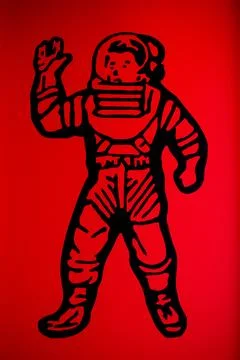 The image of an astronaut on a red background Stock Photos