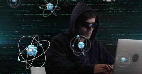 Image of atom structures over biracial male hacker using laptop to hack system Photos