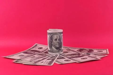 An image of bank note on a pink background. Business and economy concept. Stock Photos