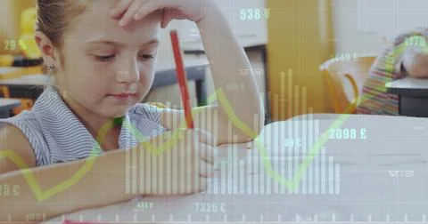 Image of bar graphs and numbers over caucasian girl writing in book in classroom Foto stock