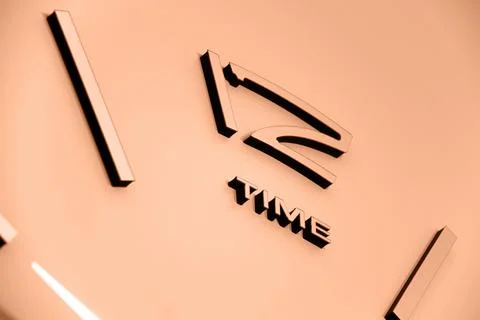 Image with big clocks. Image toned in Peach Fuzz color of the year 2024. New Foto stock