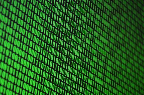 An image of a binary code made up of a set of green digits on a black backgro 스톡 사진