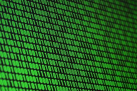 An image of a binary code made up of a set of green digits on a black backgro 스톡 사진