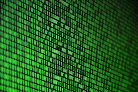 An image of a binary code made up of a set of green digits on a black backgro 写真素材