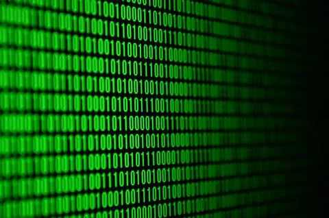 An image of a binary code made up of a set of green digits on a black backgro Stock Photos