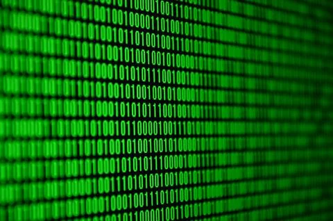 An image of a binary code made up of a set of green digits on a black backgro 스톡 사진