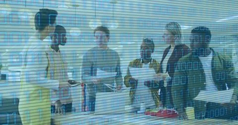 Image of binary code over diverse coworkers talking in office 스톡 사진