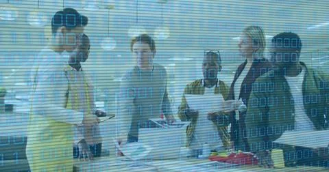 Image of binary code over diverse coworkers talking in office Stock Photos