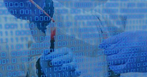 Image of binary code over hands of lab workers Foto stock