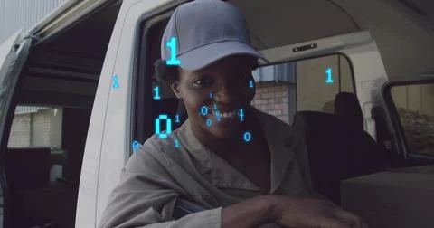 Image of binary codes over smiling african american woman sitting in vehicle at Stock Photos