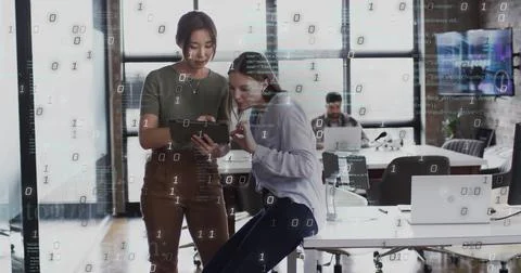 Image of binary coding data processing over diverse business people in office Foto stock