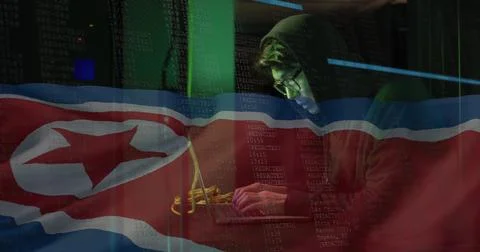 Image of binary coding with hacker over flag of north korea Stock Photos