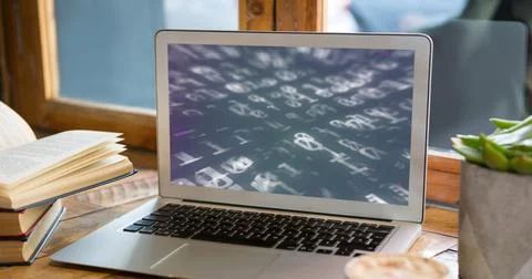Image of binary coding on laptop in office Foto stock