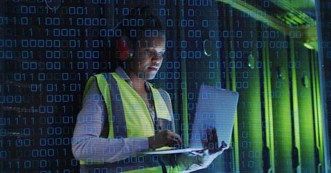 Image of binary coding over african american male it engineer and computer 写真素材