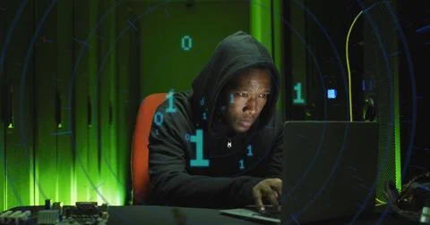 Image of binary coding over african american male hacker with computer and 스톡 사진