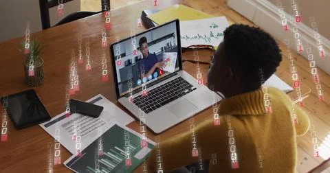 Image of binary coding over african american woman having a image call on laptop Foto stock