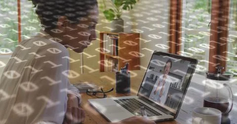 Image of binary coding over biracial businesswoman having laptop image call 스톡 사진