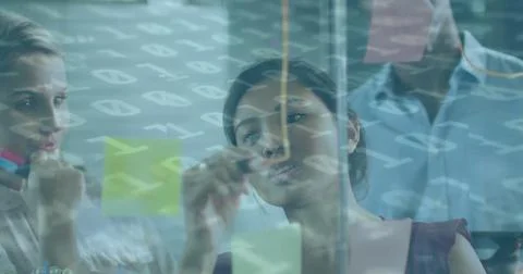 Image of binary coding over diverse business people taking notes Stock Photos