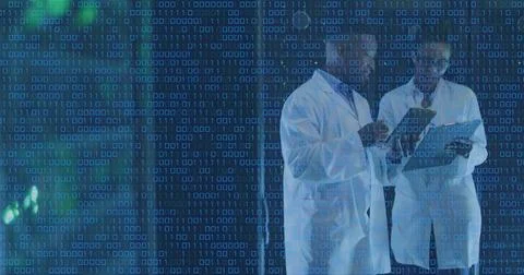 Image of binary coding over diverse male and female engineers discussing at Stock Photos