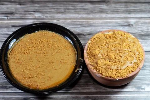 An image of Biscuits butter spread and pieces topping on rice pudding also .. Stock Photos