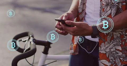 Image of bitcoin icons, data processing over african american man using Stock Photos