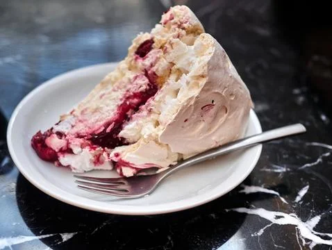 Image of Black Forest gateau with piped whipped cream rosettes topped with Stock Photos