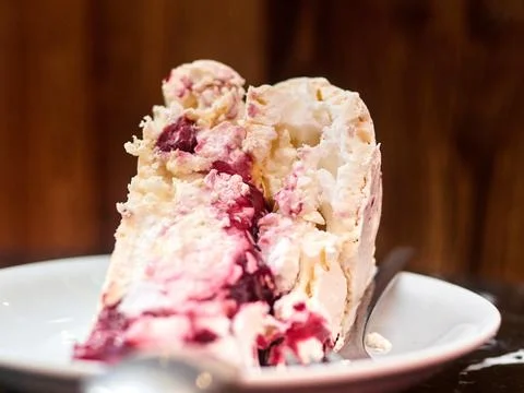 Image of Black Forest gateau with piped whipped cream rosettes topped with Stock Photos