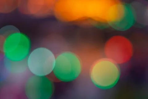 Image of blurred bokeh background with warm colorful lights. (vintage tone) Stock Photos