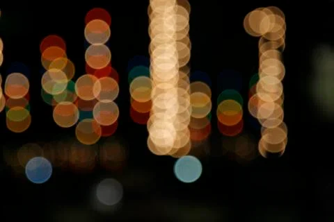Image of blurred bokeh background with warm colorful lights. Abstract circula Stock Photos