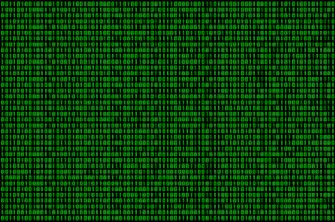 Image of a blurry binary code composed of a set of green numbers on a black b 스톡 사진
