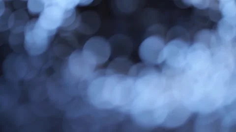 The image is a blurry blue background with a dark blue circle in the center Stock Footage 300525827