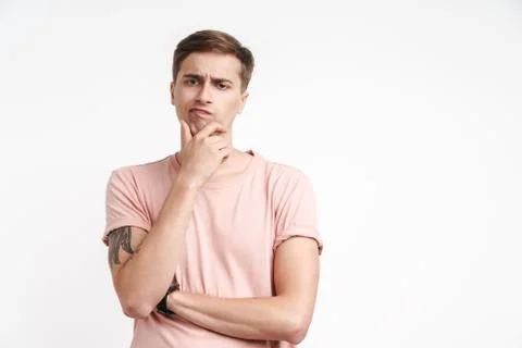 Image of brooding caucasian man thinking with touching his chin Stock Photos