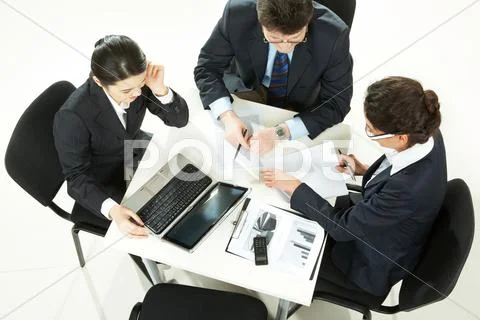 Image of business partners planning work at meeting Stock Photos