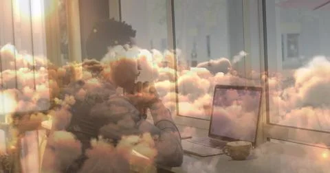 Image of businessman using laptop in office over moving clouds Stock Illustration