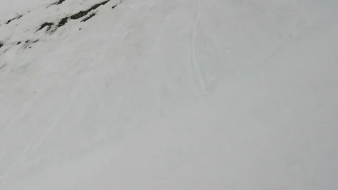 Image via cable car window passing over pistes skiers speed down the s Stock Footage 71175522