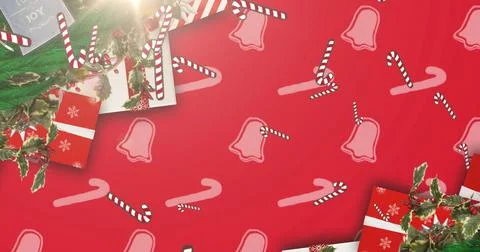 Image of candy canes falling at christmas over presents Stock Illustration