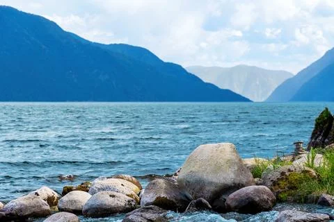 This image captures a tranquil scene of a teletskoe lake Stock Photos