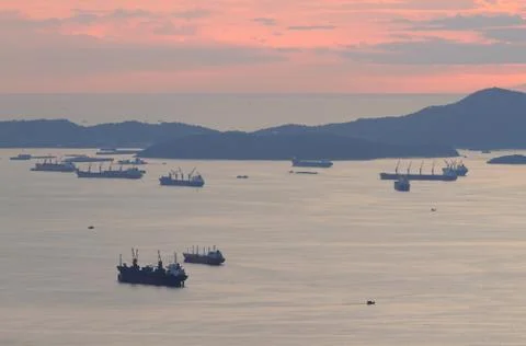 Image of cargo ship at twilight time. Stock Photos