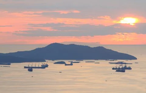 Image of cargo ship at twilight time. Stock Photos