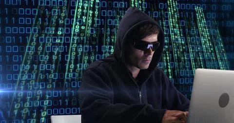 Image of caucasian hacker over data processing on dark background Stock Photos