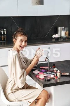 Image Of Caucasian Young Beautiful Woman Applying Face Makeup At Home