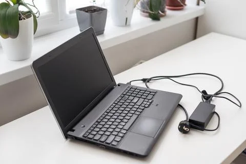 Image of charging a laptop Stock-Fotos
