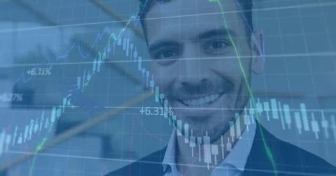 Image of chart and data processing over happy caucasian bsuinessman using 写真素材