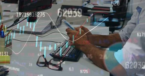 Image of charts and processing data over biracial businessman at office using Foto stock