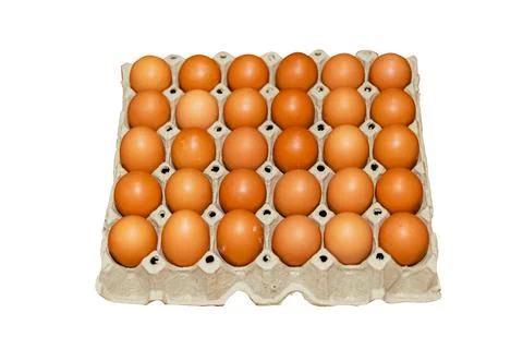 Image of chicken eggs in a tray in the kitchen with a clipping path.. Stock Photos